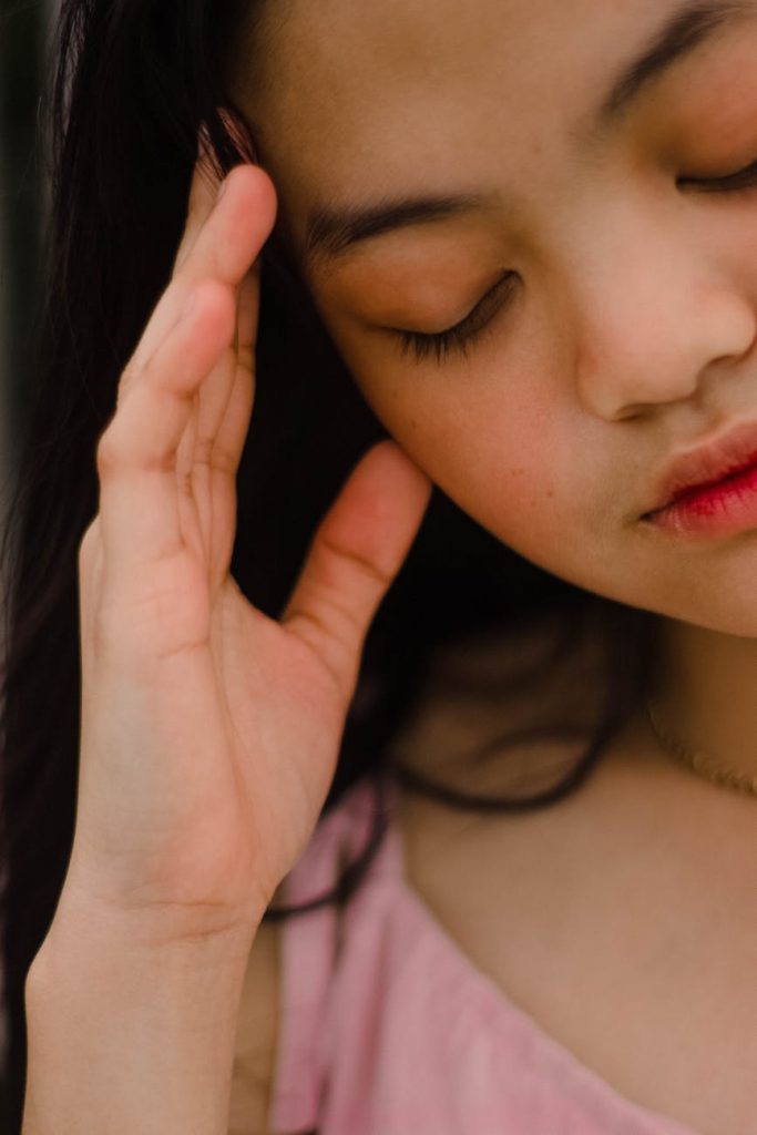 woman holding her head