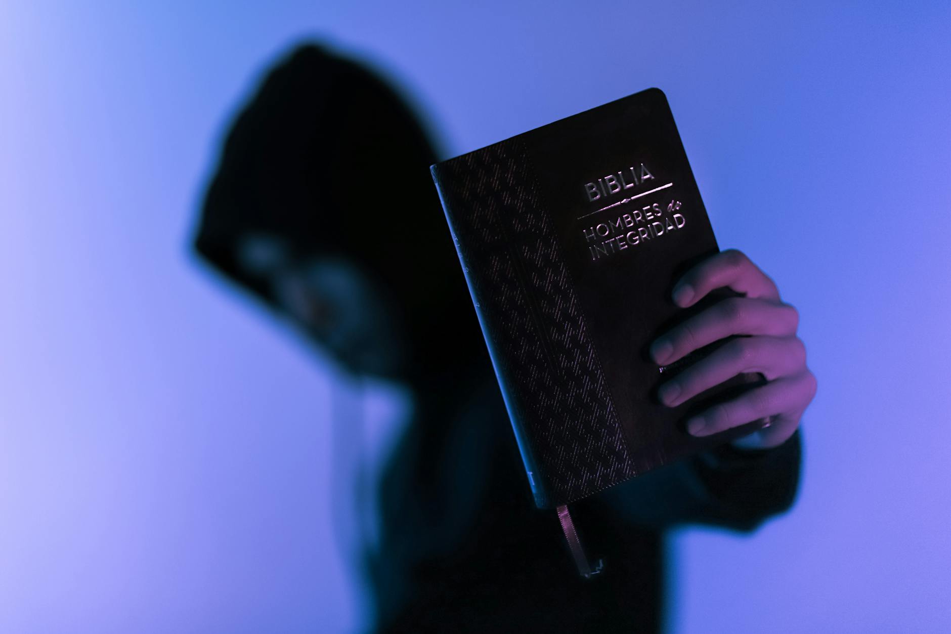 person holding bible