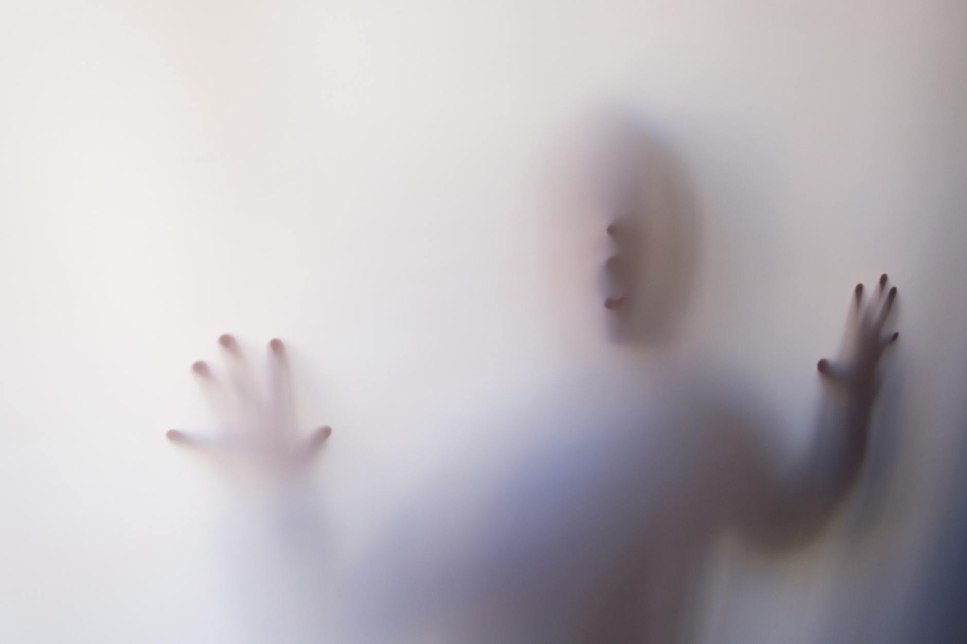 person behind white cover